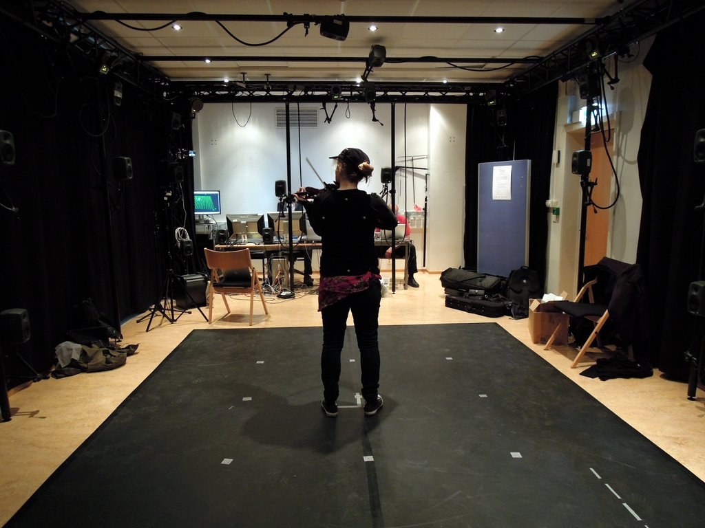 An earlier black box with motion capture cameras and a participant