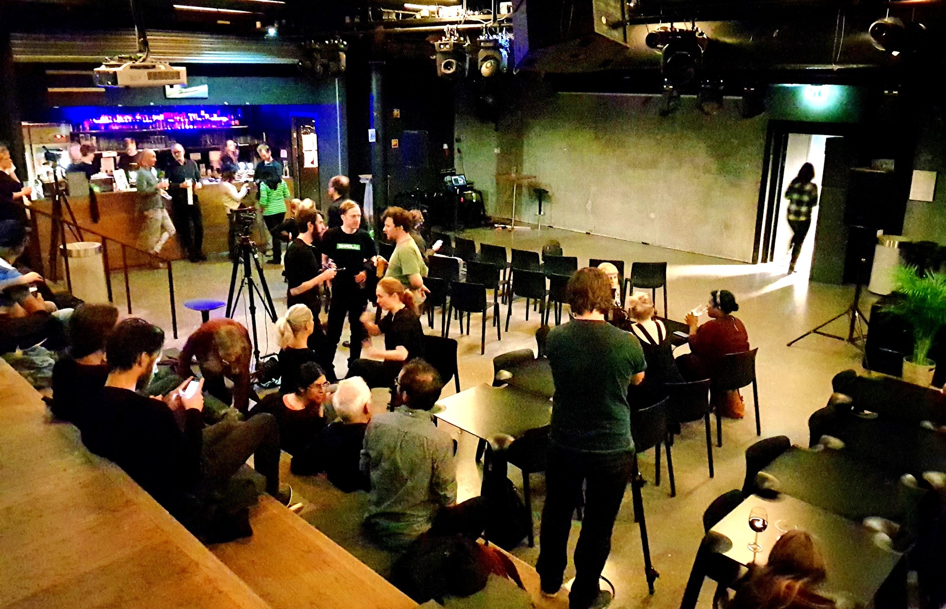 An audience at a MusicLab event in a café venue