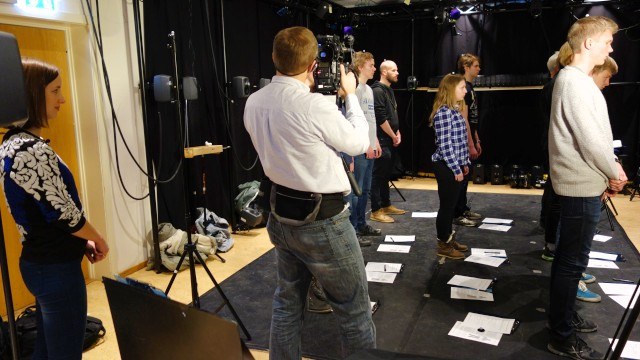 Participants standing still in the lab while researchers watch